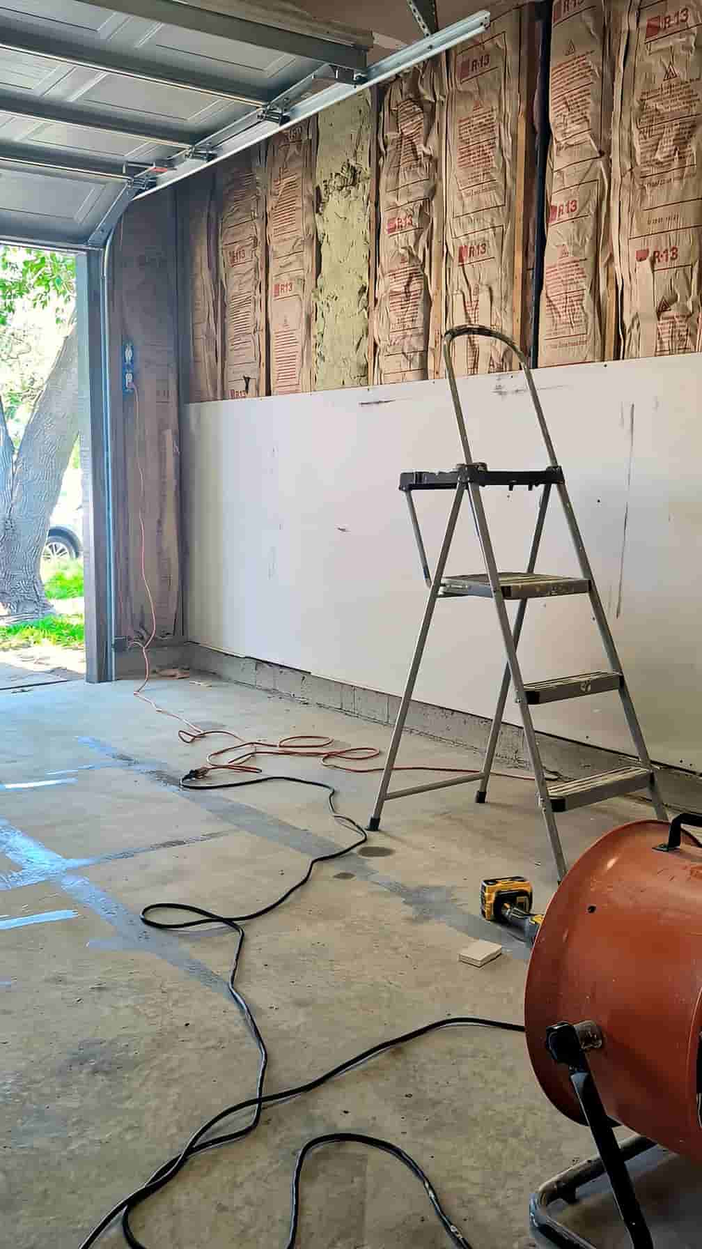 Drywall being hung in an unfinished garage in Raleigh, NC