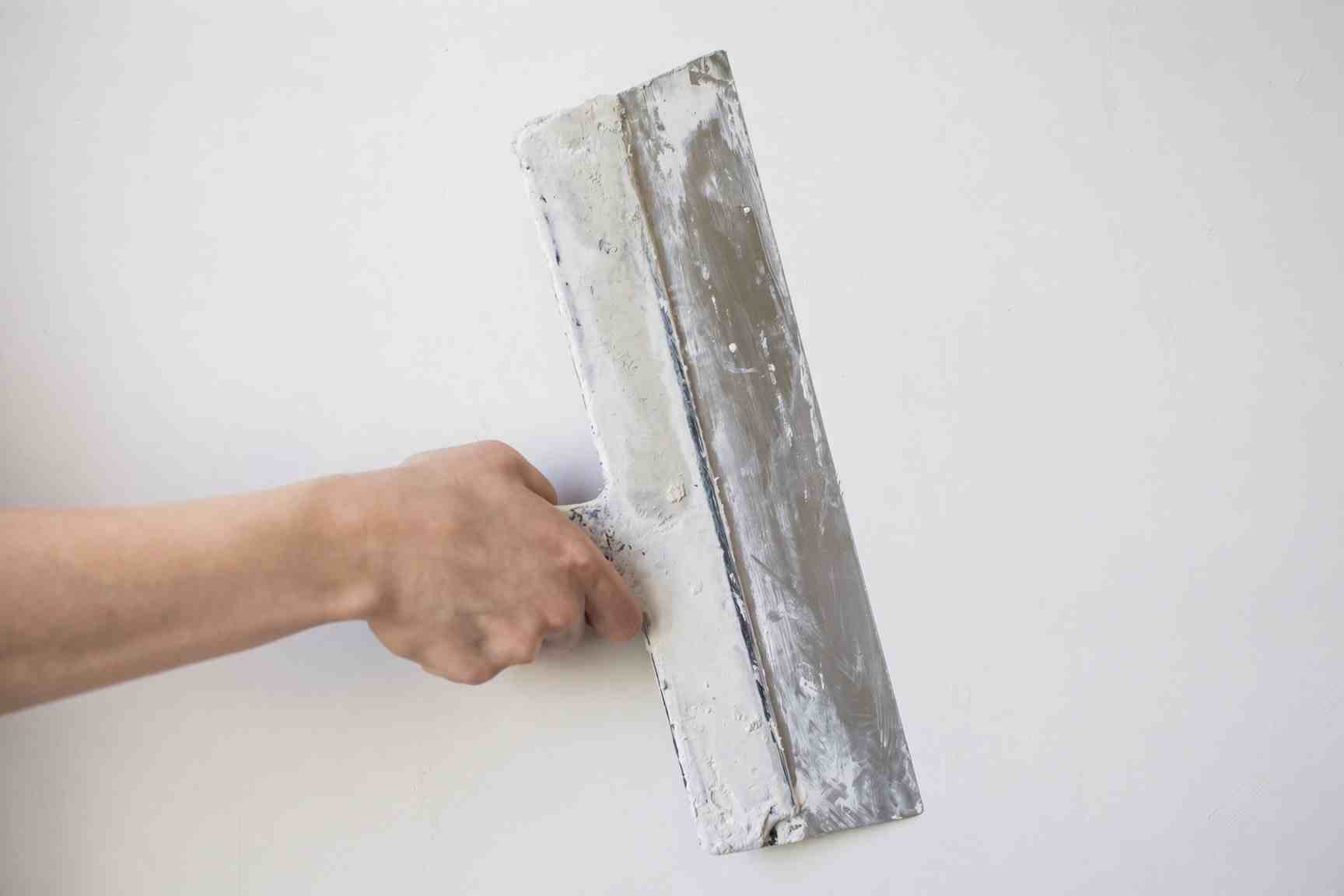 Skim coating textured walls to a smooth finish in Raleigh